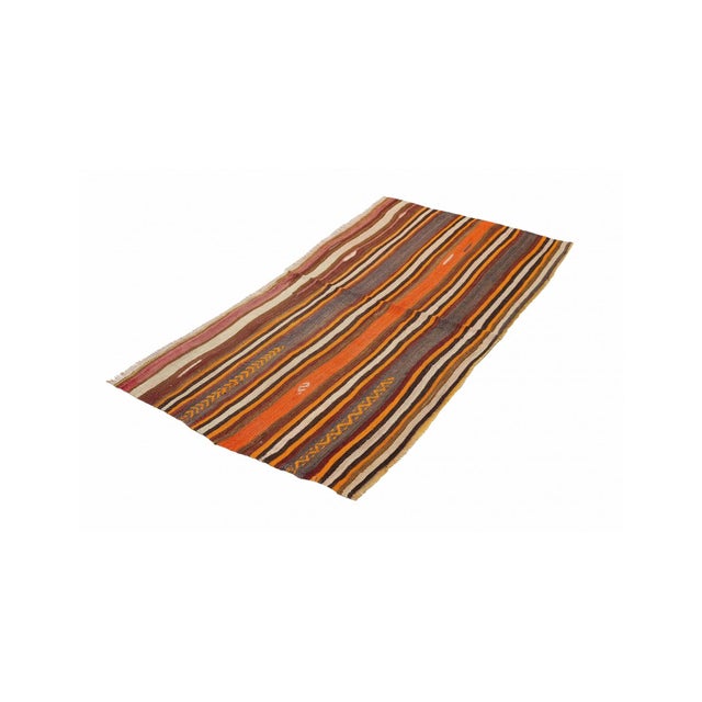 Handwoven vintage striped decorative kilim rug from Denizli region of Turkey. Approximately 50-60 years old. In very good...