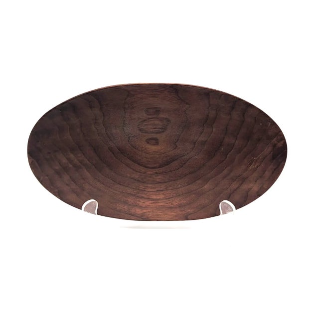 Offered is a mid 20th Century Scandinavian turned and lathed Teak wood oval-shaped shallow bowl that bears a faint...