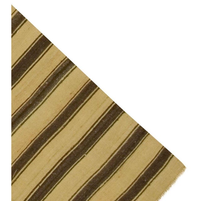 This vintage Turkish flat-weave Kilim, handwoven in the 1940s, showcases a striking balance of simplicity and boldness....