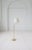 This Mid-Century Modern floor lamp were manufactured in Sweden for Luxus. The rounded base and rod are made in brass. The...