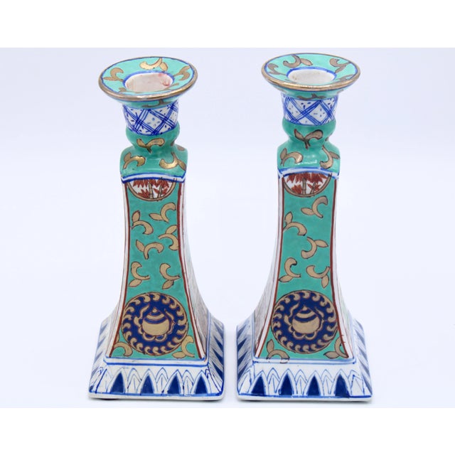 A lovely pair of vintage ceramic turquoise patterned candlesticks by Nora Fenton, circa 1960s. The Nora Fenton sticker is...