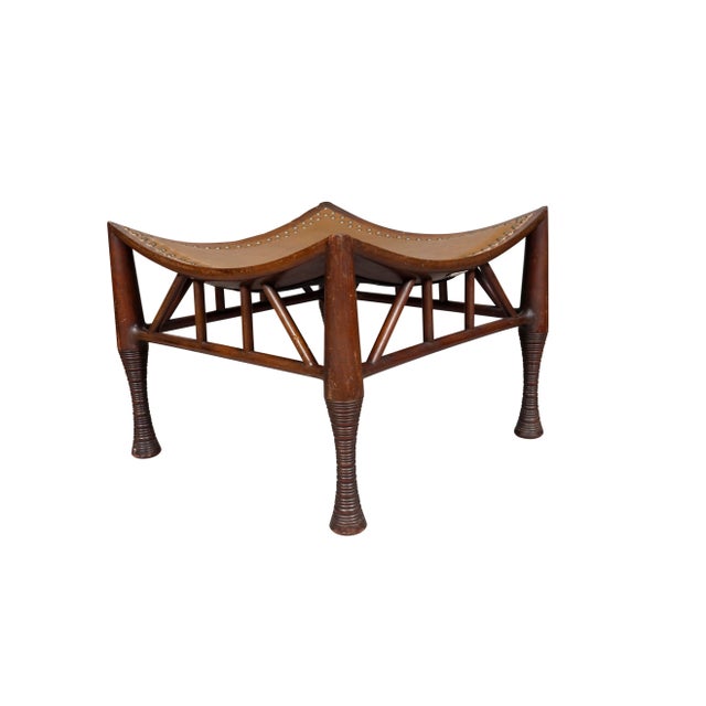 Liberty & Company Mahogany Thebes Stool typical form with new leather with tacks. With label from Liberty on base. From a...