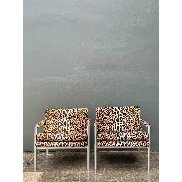 Make a bold statement with this striking pair of vintage leopard print lounge chairs. Combining the sleek, industrial...