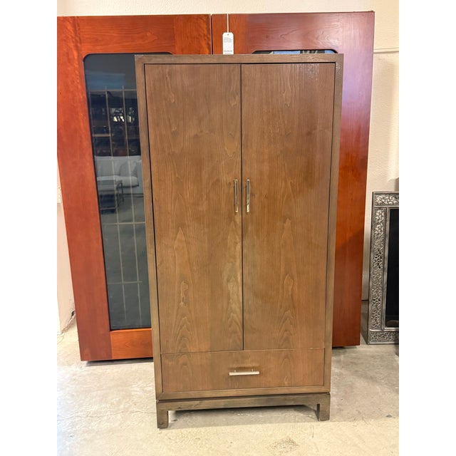 Design Plus Gallery presents a Bespoke Modern Wardrobe Armoire. This tall storage cabinet has a streamlined rectangular...