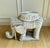 A wonderfully sculptural vintage wicker elephant side table, circa 1970s, handwoven over a sturdy internal frame and...