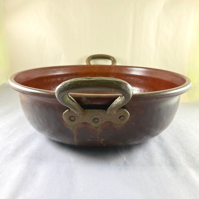 A super-sized, hand-hammered copper pot with brass carrying handles, England, circa 1860. Very heavy, beautifully hand...