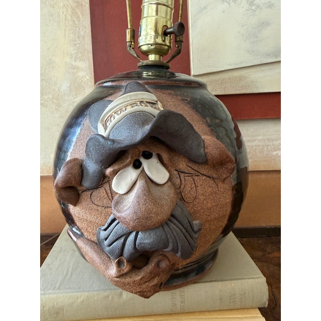 Add a touch of rustic Americana to your home with this whimsical vintage Mahon Made Stoneware (MMS) table lamp....
