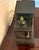 A striking antique French black marble and gilt brass architectural mantel clock dating from the late 19th century. The...