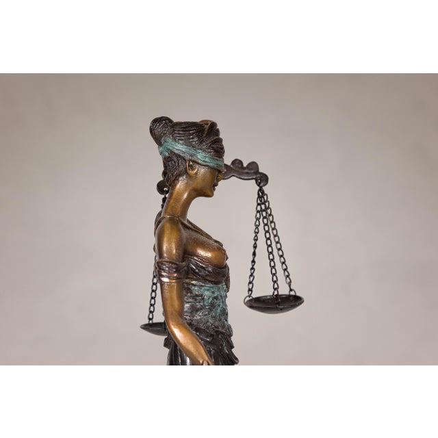 Lady Justice, a cast bronze tabletop statuette with scales and sword. This exquisite Lady Justice bronze statuette...
