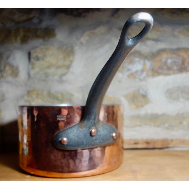 Hand hammered copper saucepan, holds 2.5 quarts. Beautiful patina and in excellent condition. 7" deep, 7" wide, 4" tall...