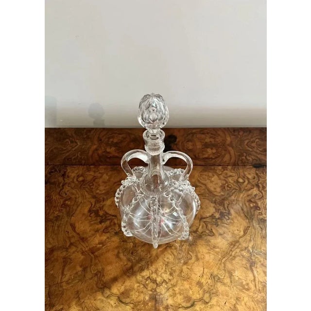 Fantastic quality Georgian Dutch decanter having a circular shaped decanter with rigaree decoration, twin handles to the...