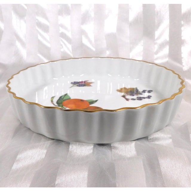 This is a Royal Worcester Fluted Tart Pan. It has a fruit design, but doesn’t appear to be any of the Evesham patterns. It...