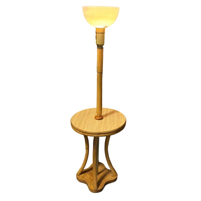 This restored Mid-century rattan & mahogany hourglass-shaped side table floor lamp, is perfect for holding your old...