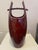 These pieces are an original Jens H Quistgaard (1980-1990) ceramic umbrella stand and matching vase The oxblood red...