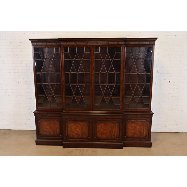 A gorgeous monumental Georgian or Chippendale style breakfront bookcase or dining cabinet By Baker Furniture USA, Circa...
