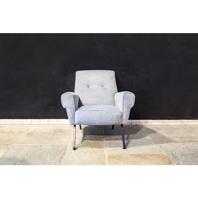 Pair of armchairs with padding covered in fabric, metal legs. Italian production 60's