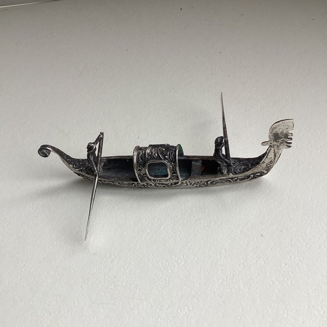 Italian miniature Venetian gondola figurine, 800 mark continental silver. Ornate, intricate decoration of carved hull,...