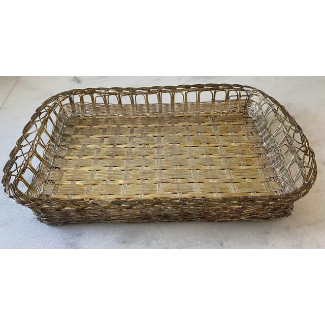 Vintage silver plated metal basket with woven detail. Perfect to hold a casserole dish or use for napkins and utensils at...