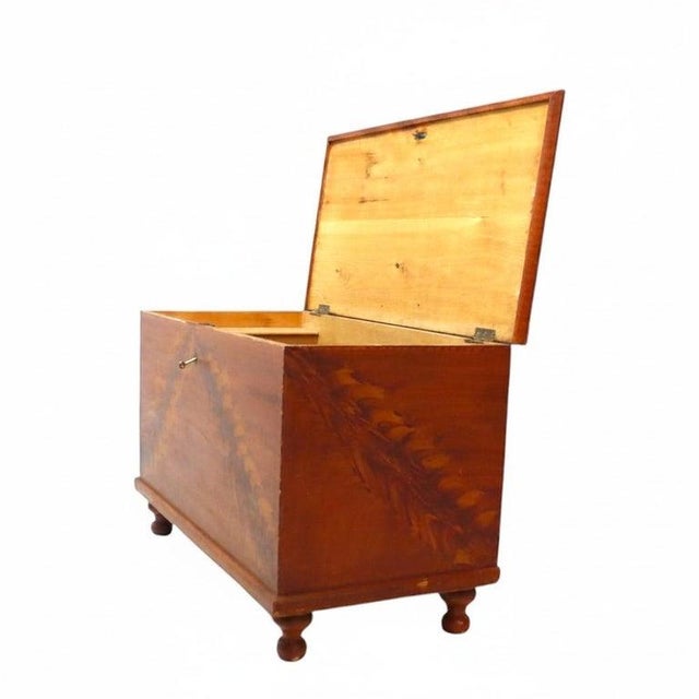 This 19th-century primitive blanket chest is crafted from softwood and exhibits a distinctive hand-painted pattern across...