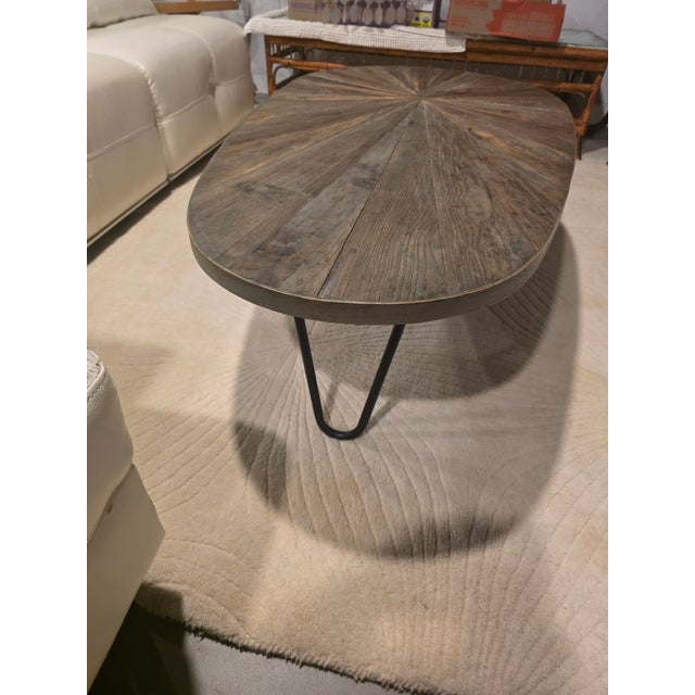 The Leveni coffee table by Uttermost represents contemporary furniture design that draws inspiration from mid-century...