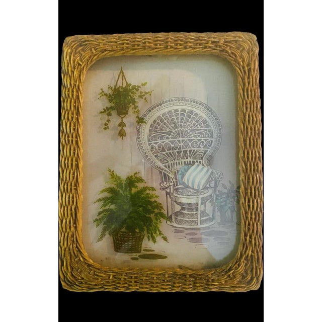 Adorable French wicker frame with the famous Emmanuelle Peacock chair. A 3D version painted on the glass is the plant and...