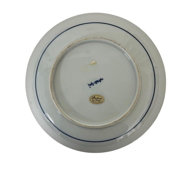 Andrea by Sadek chinoiserie blue white decorative plate. The heavily saturated cobalt blue color makes a stunning addition...