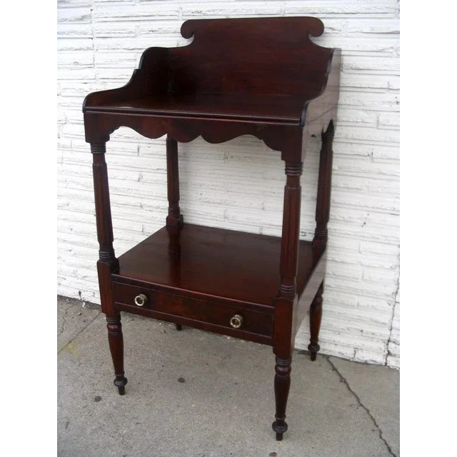 American mahogany wash stand. One drawer, brass pulls, fluted column and turned legs. 20 1/2 x 17 x 40 1/2 Original...