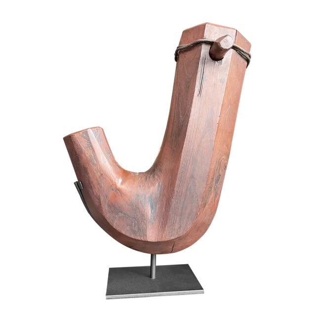 A Japanese kettle hook from the Edo period carved of Zelkova wood. The jizagaki is the hook from which an iron kettle for...