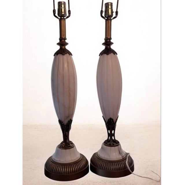 Elevate your interior with this exceptional pair of vintage mid-century table lamps, showcasing a sophisticated blend of...