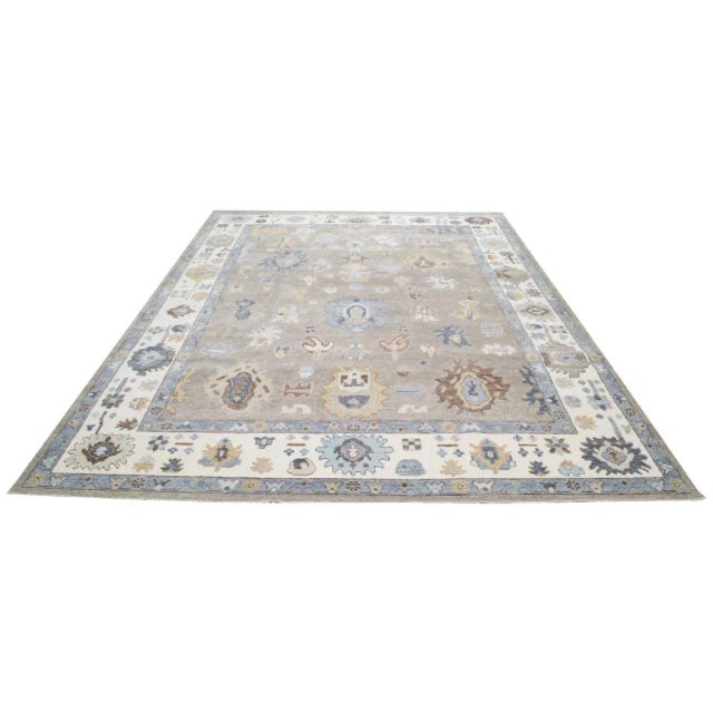 Oushak hand knotted organic wool rug with natural colors.
