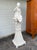 An extremely large blanc de chine crackle glazed terracotta figure in Chinese taste, modeled in the form of a playful,...