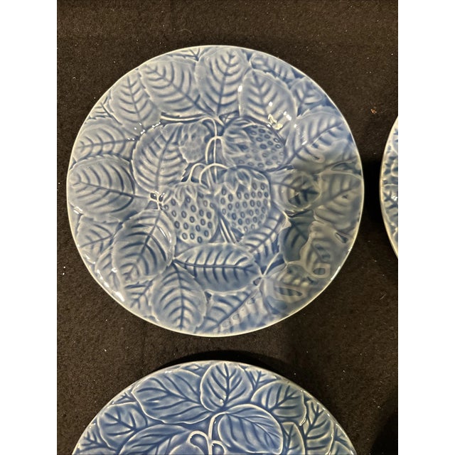Bring vibrant Portuguese artistry to your table with this set of four Bordallo Pinheiro blue fruit salad plates. Known for...