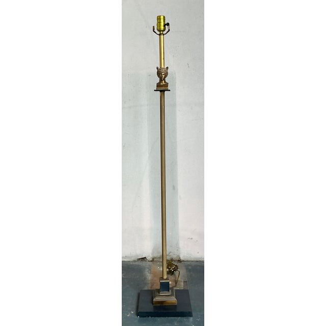 Command attention with this captivating vintage floor lamp, embodying the dramatic flair of Hollywood Regency design with...