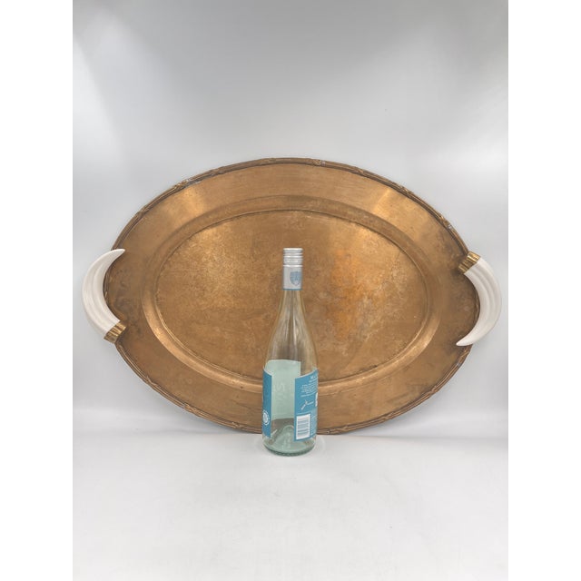 Hollywood Regency Vintage Italian Hollywood Regency Oval Statement Size Brass Tray With Faux Boar Tusk Handles and Cross Strap Trim For Sale - Image 3 of 16