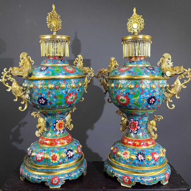 This monumental pair of incense burners, styled as palace lanterns, is masterfully crafted from gilt bronze and richly...