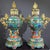 This monumental pair of incense burners, styled as palace lanterns, is masterfully crafted from gilt bronze and richly...
