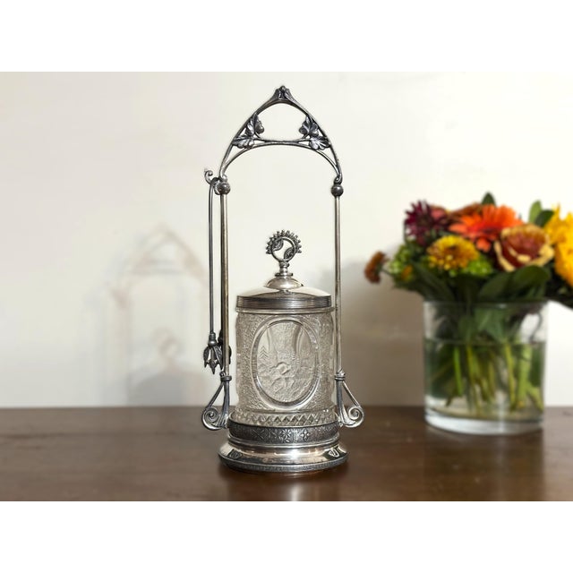 Antique Rogers, Smith & Co. pickle castor with Victorian quadruple-plated frame, pressed glass insert, fitted lid, and...