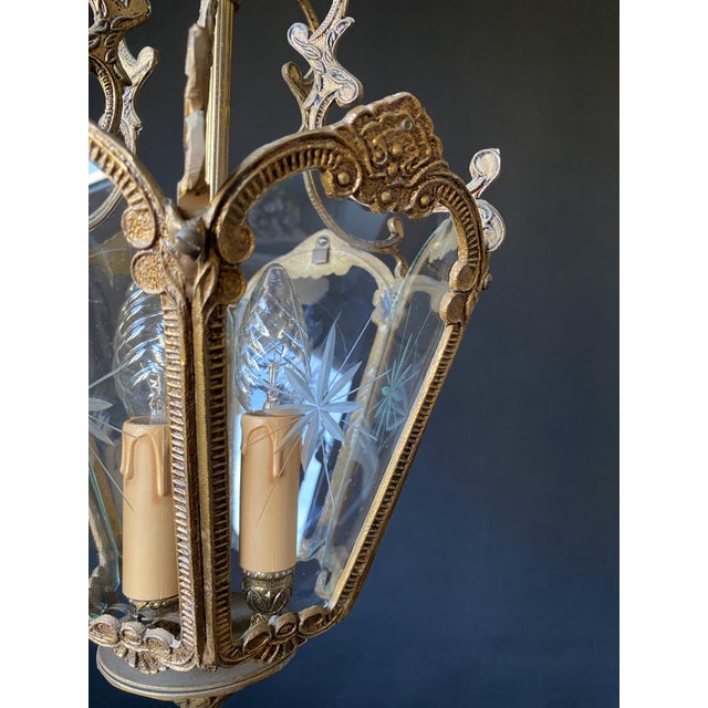 The chandelier is made of brass and bronze - a beautiful artistic forging. Decorated with glass inlays with ornaments....