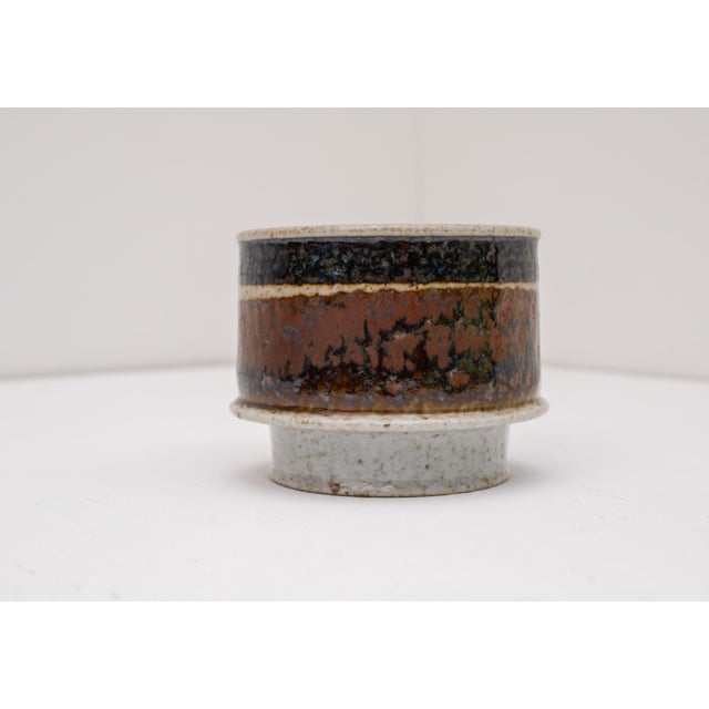A rare studio-produced Brutalist ceramic vase designed and signed by Inger Persson for Rörstrand, Sweden. As a studio...