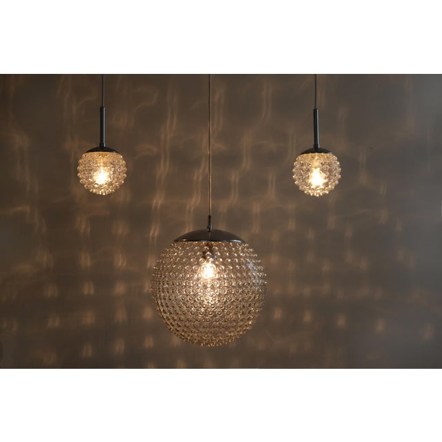 Set of 3 staff pendant lights, 1960s 1 x model p117 2 x model p117 (small) design: rolf krüger large: 33cm diameter small:...