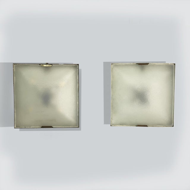 Italian mid-century modern wall lamps by Stilnovo, 1950s Pair of square wall lamps with metal and brass frames and...
