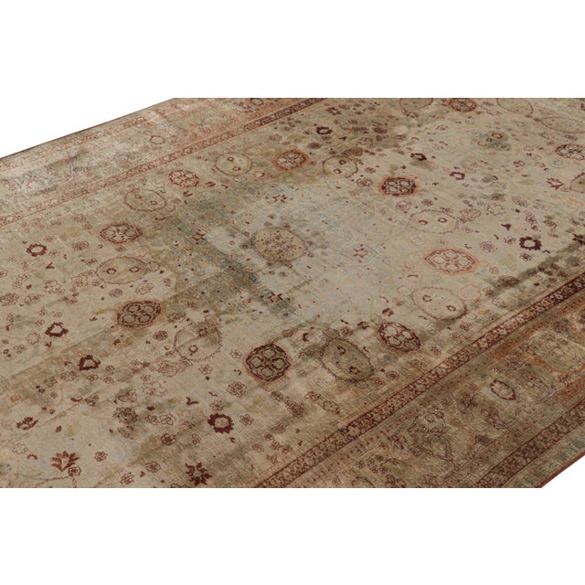 Made with hand-knotted silk, circa 1910-1920, this 6x10 antique Persian rug of Tabriz provenance is one of the most...