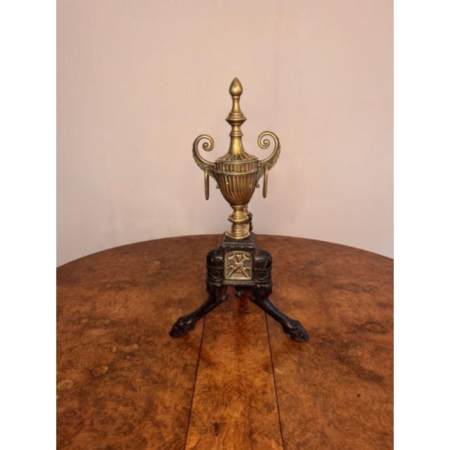 Fine quality pair of antique Victorian brass and iron fire dogs, having a quality pair of brass and iron fire dogs with...