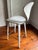 Norman Cherner's iconic 1958 molded plywood stool design, produced under license by The Cherner Chair Company from the...