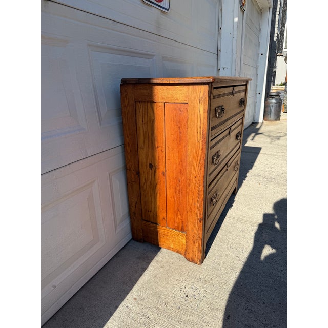 We have an absolutely stunning antique Victorian Eastlake oak dresser for sale. It features three dovetailed drawers,...
