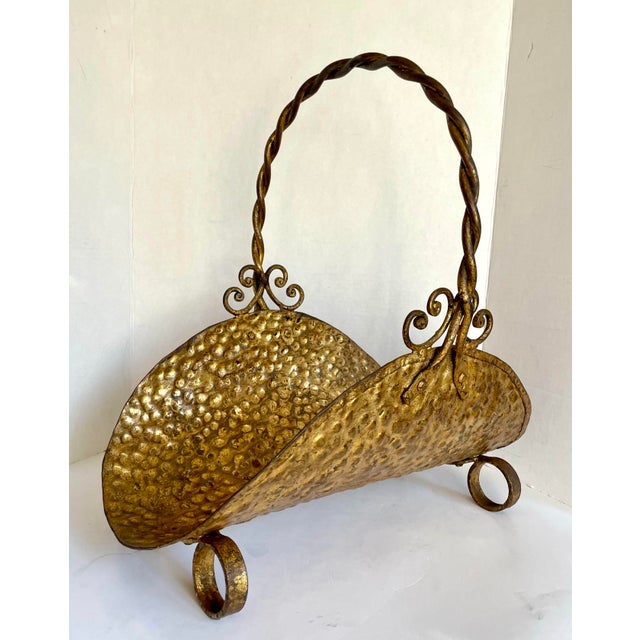 Here is a beautiful, hammered metal firewood holder with twisted metal handle and scrolled metal details. The finish of...