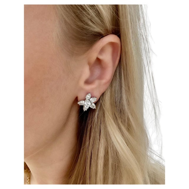 These classic sparkly cluster earrings contain 12 pear shaped diamonds weighing 5.48 carats total. The perfect earring for...