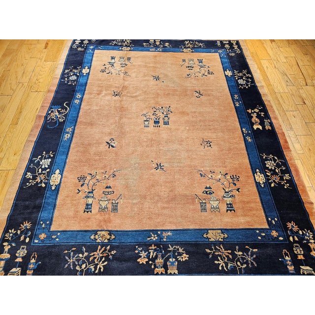 This vintage hand-knotted Chinese Peking rug from the late 19th century embodies the meditative elegance that has made...