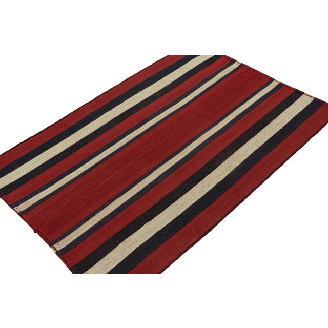 This vintage 5x7 Persian Kilim is a mid-century tribal rug, handwoven in wool circa 1950-1960. Its design most likely...