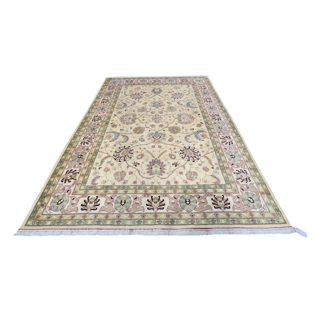 Afghan Oushak rug, hand-knotted in Afghanistan from 100% wool. Measuring 8’4” x 11’2”, the rug features a traditional...